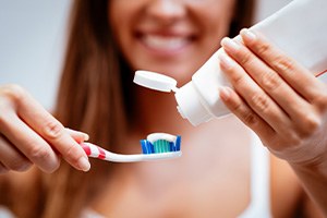 Woman preparing to brush her teeth