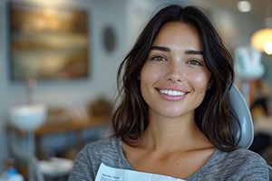 Smiling cosmetic dentistry patient in treatment chair