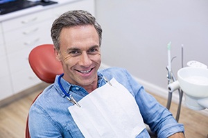 Smiling man in dental treatment chair